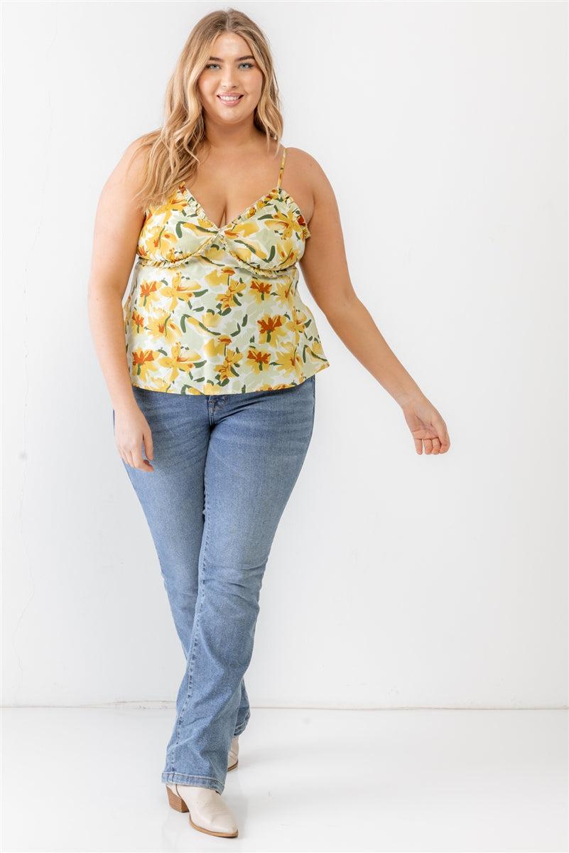 Plus size floral print tank top with adjustable straps and ruffle detail, paired with jeans, showcasing a casual and stylish look.