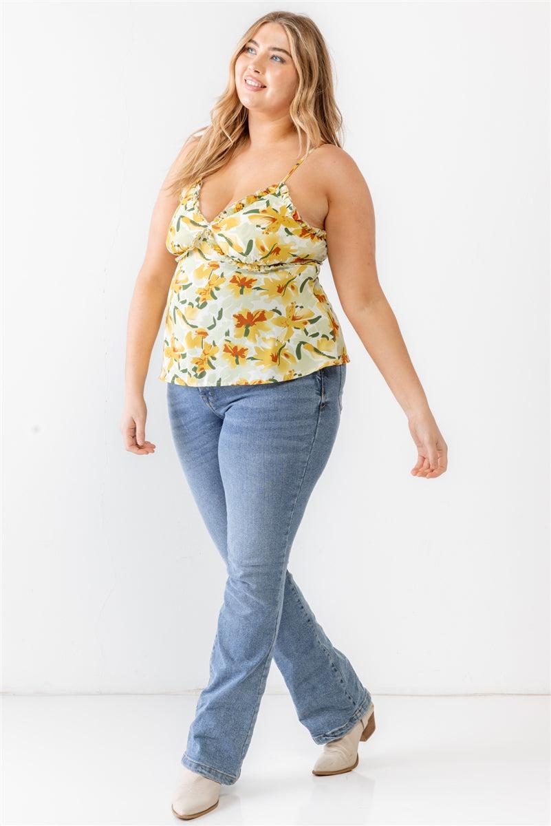 Plus size woman wearing floral print tank top with jeans, showcasing casual summer fashion and style.