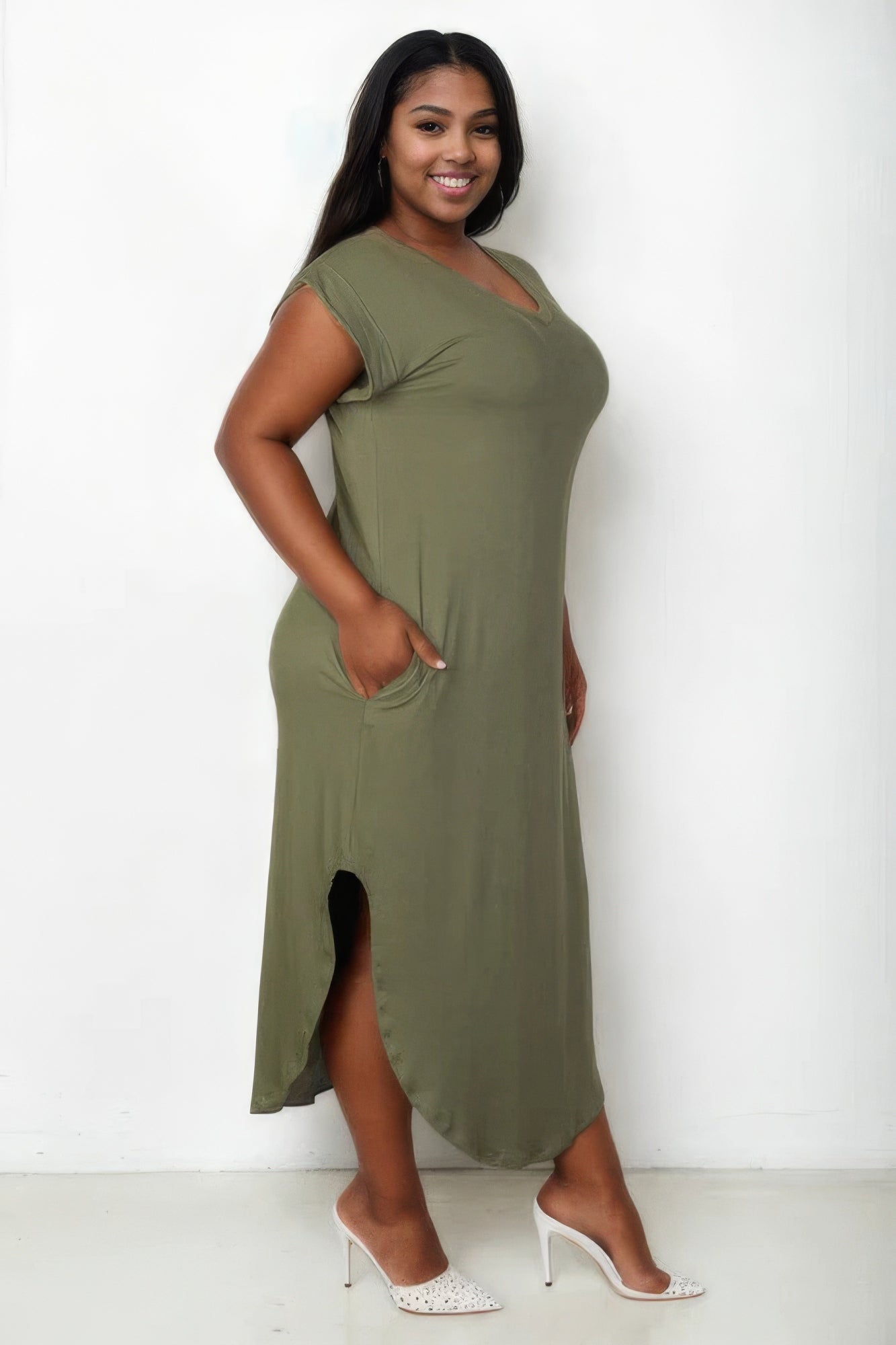 Plus size olive maxi dress with V-neck and batwing sleeves, featuring concealed pockets and a flattering silhouette.