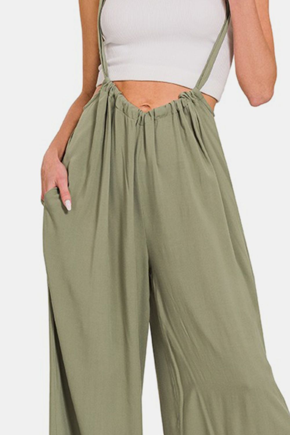 Stylish green pocketed wide leg overalls with ruched detailing and adjustable straps for a chic, customized fit.