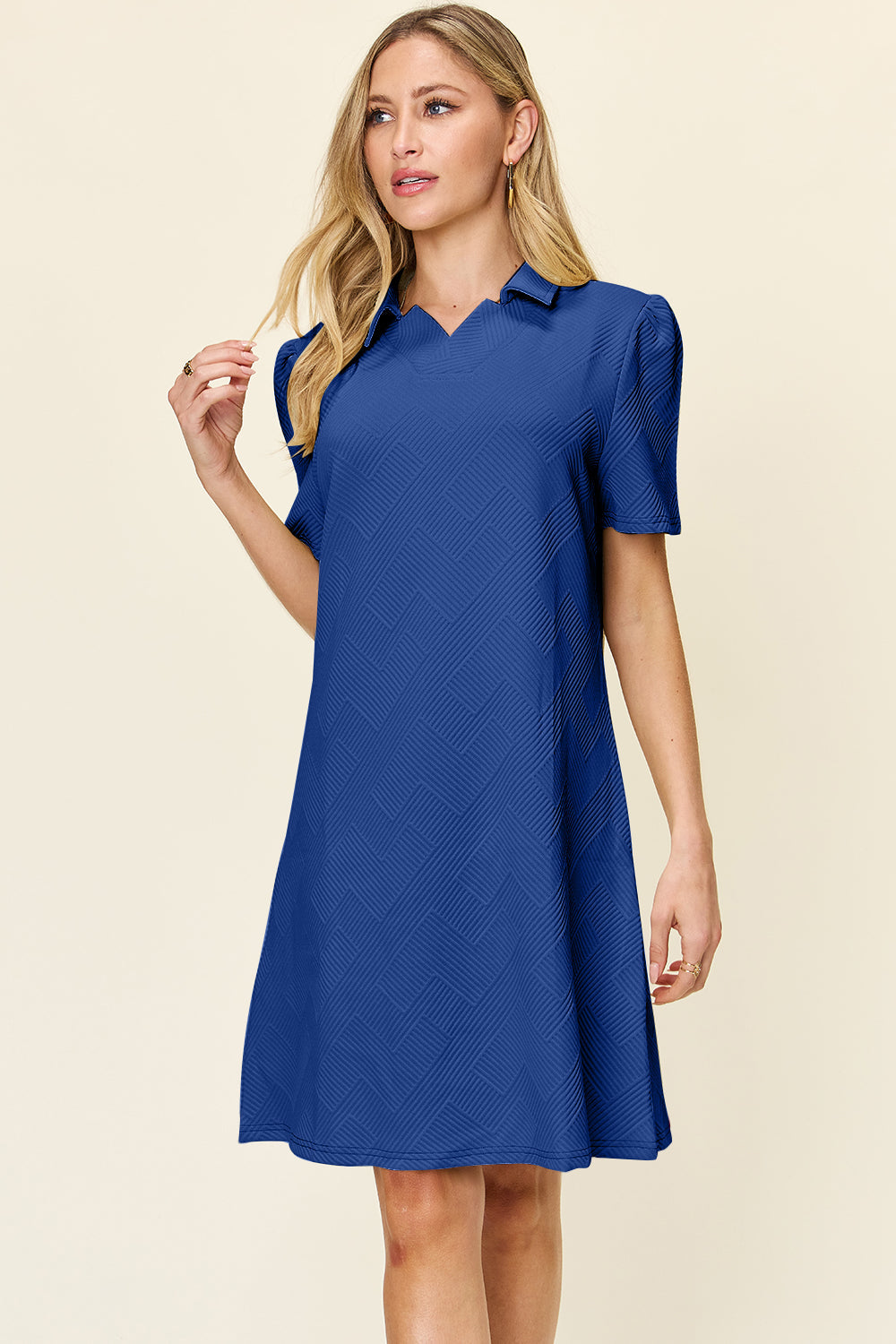 Elegant blue texture collared neck short sleeve dress with slight stretch, made of 98% polyester and 2% spandex.