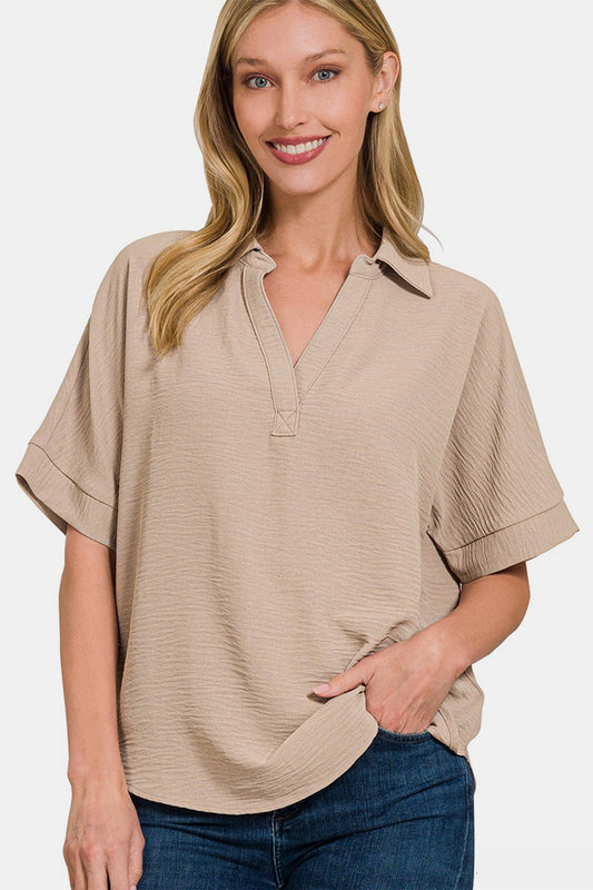 Chic textured collared neck short sleeve top with a flattering fit and versatile style for casual or dressy occasions.