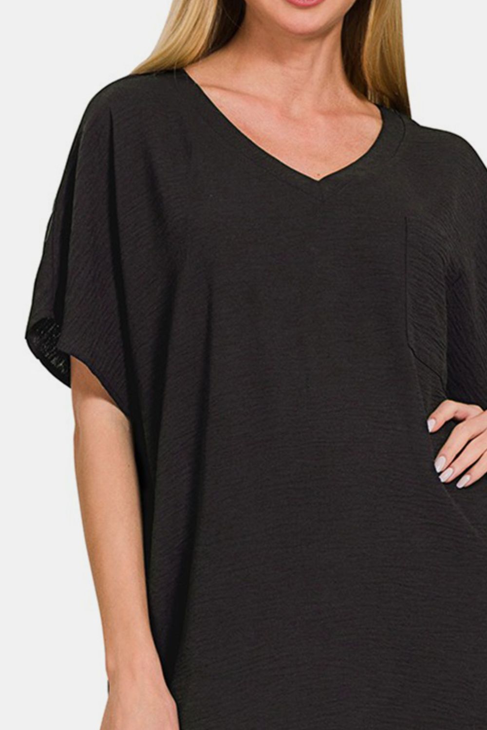 Black V-neck tee dress with pockets, short sleeves, and lightweight polyester fabric for a chic and versatile look.