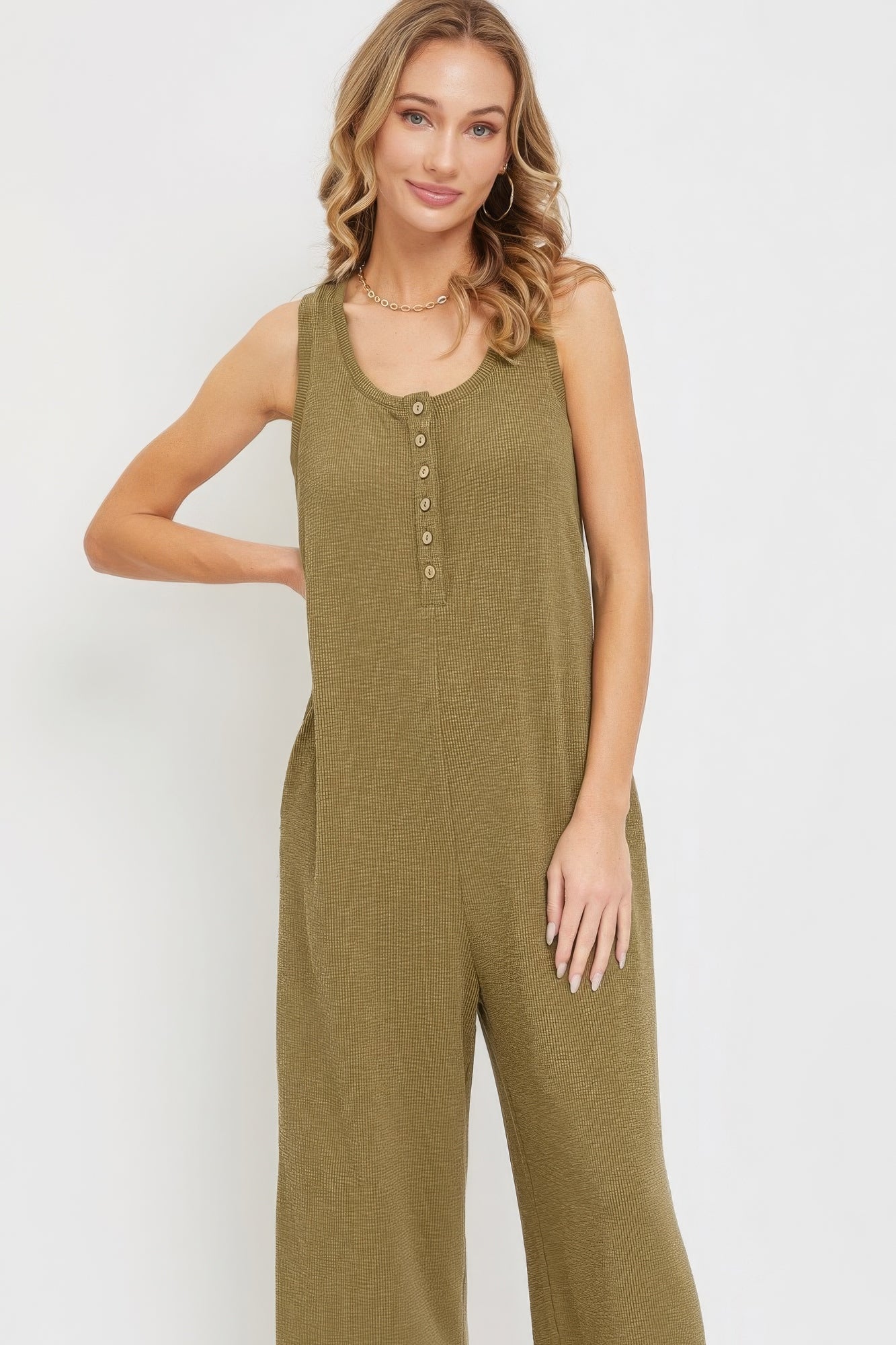 Women's sleeveless buttondown jumpsuit in olive green with relaxed fit and side pockets.