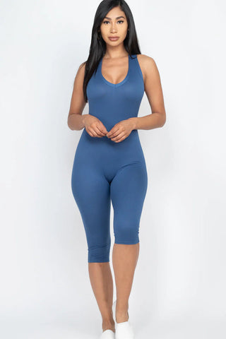 Chic women's capri jumpsuit with racer back in blue, showcasing trendy summer style and flattering silhouette.