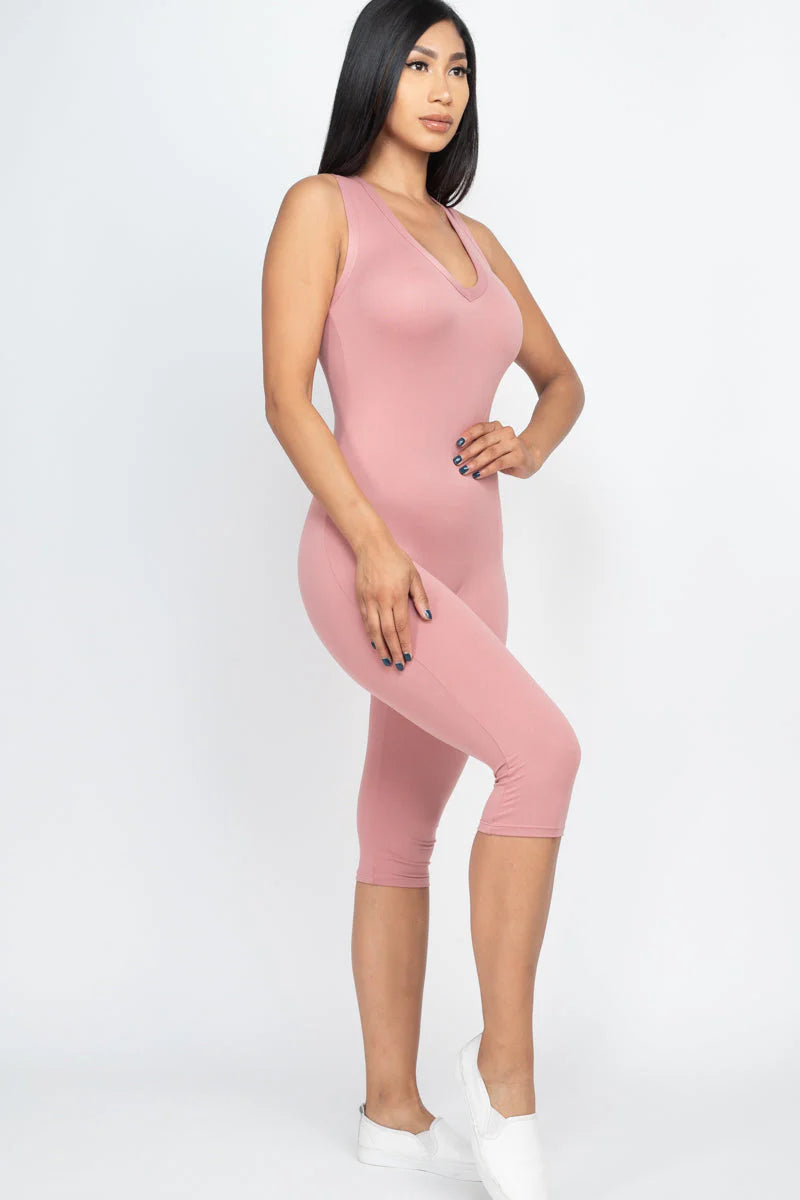 Sleeveless pink capri jumpsuit for women with racer back design, showcasing trendy summer style and comfortable fit.