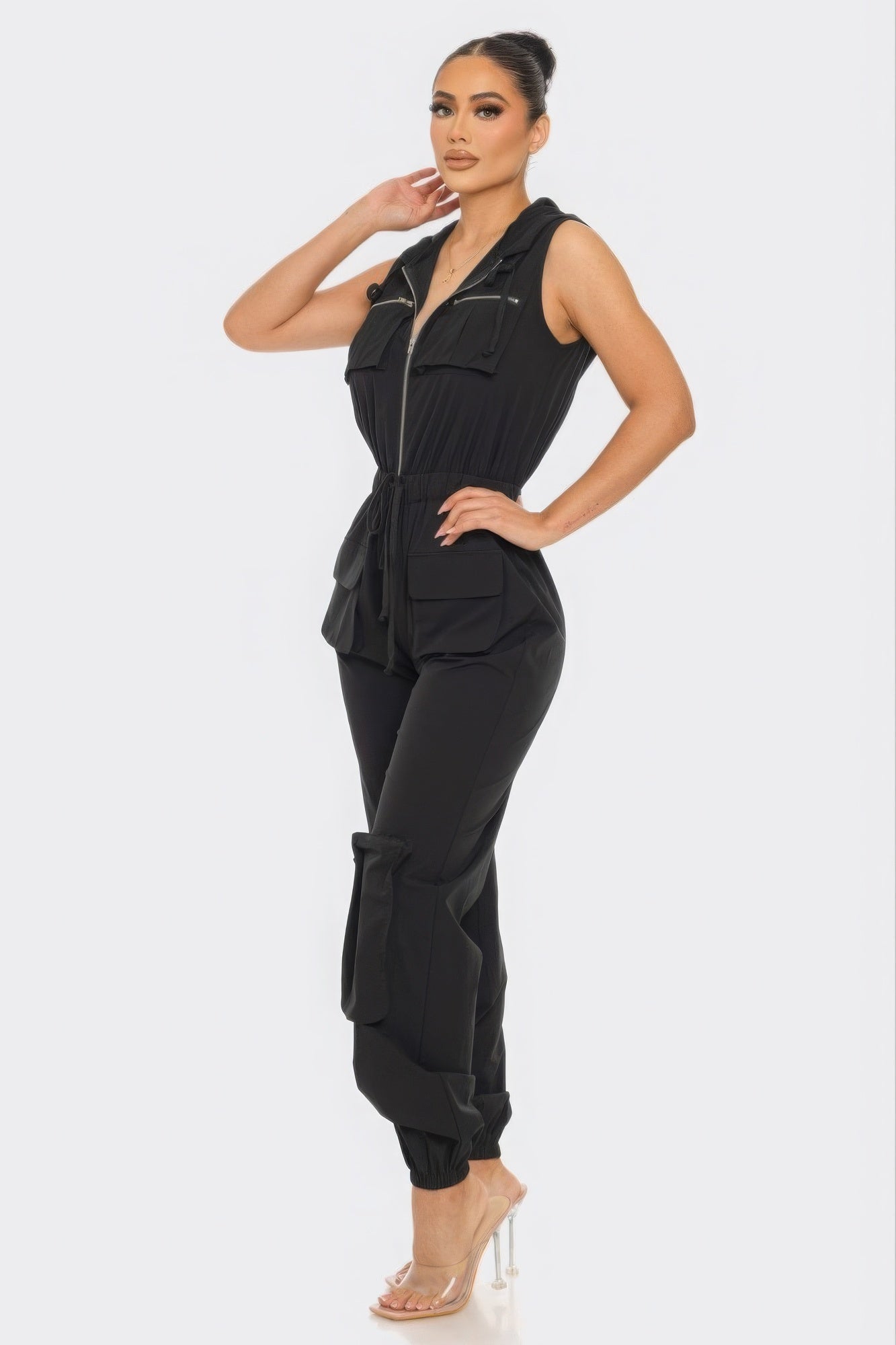 Chic women's black Tracy cargo jumpsuit with utility design and zip closure, perfect for stylish all-day comfort.