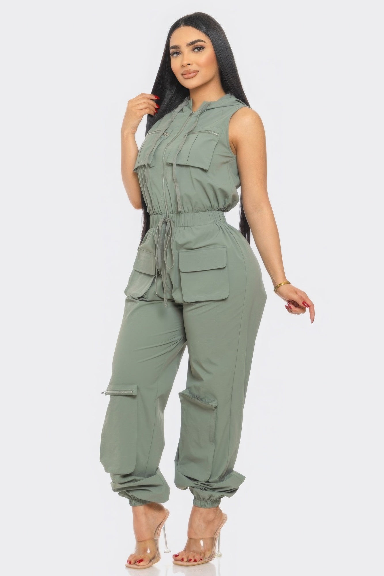 Chic women's Tracy cargo jumpsuit in green, featuring a relaxed fit, zip closure, and utility pockets for stylish all-day comfort.