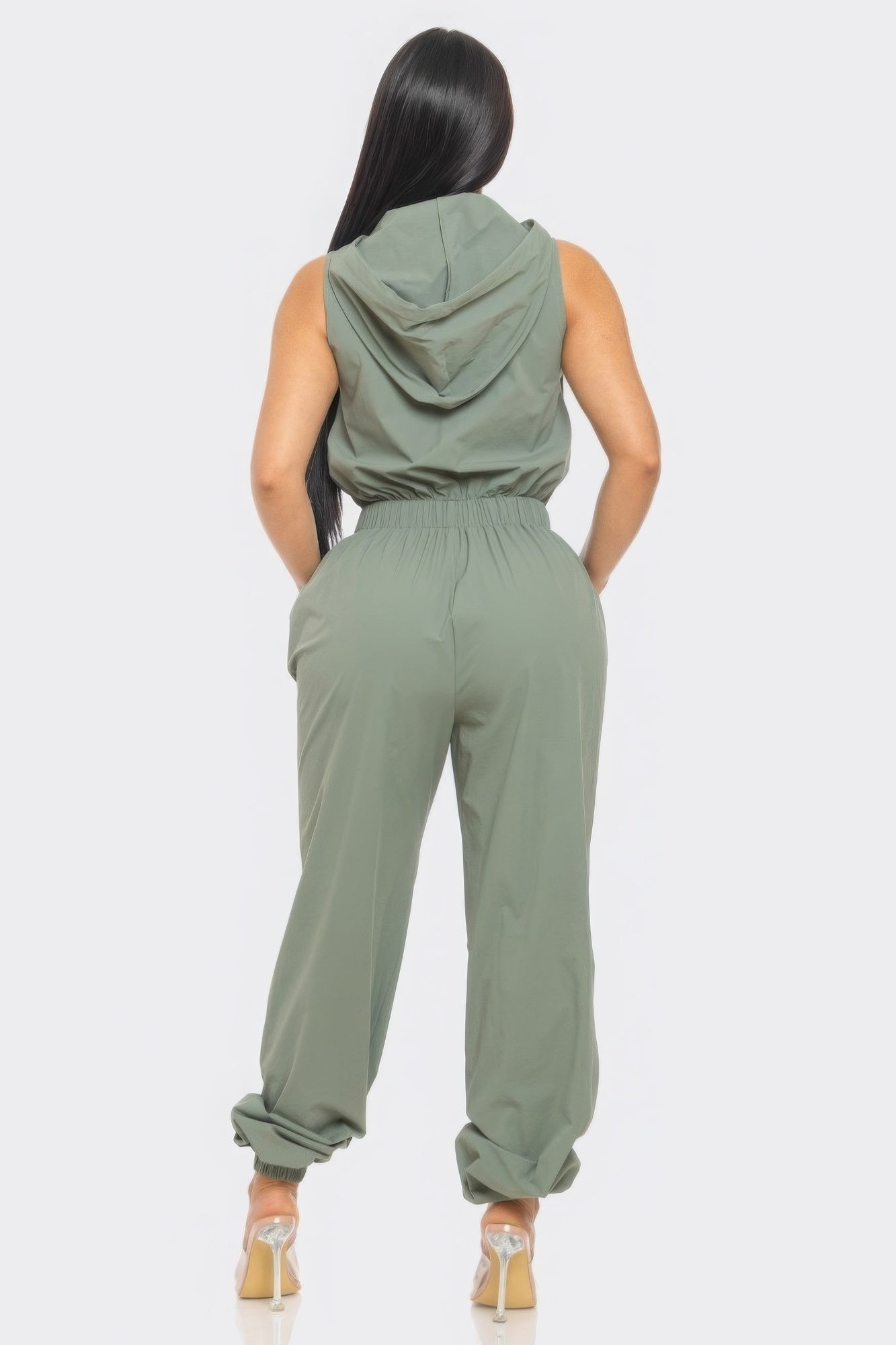 Chic Women's Tracy Cargo Jumpsuit in green with hoodie and utility design, showcasing relaxed fit and stylish back view.