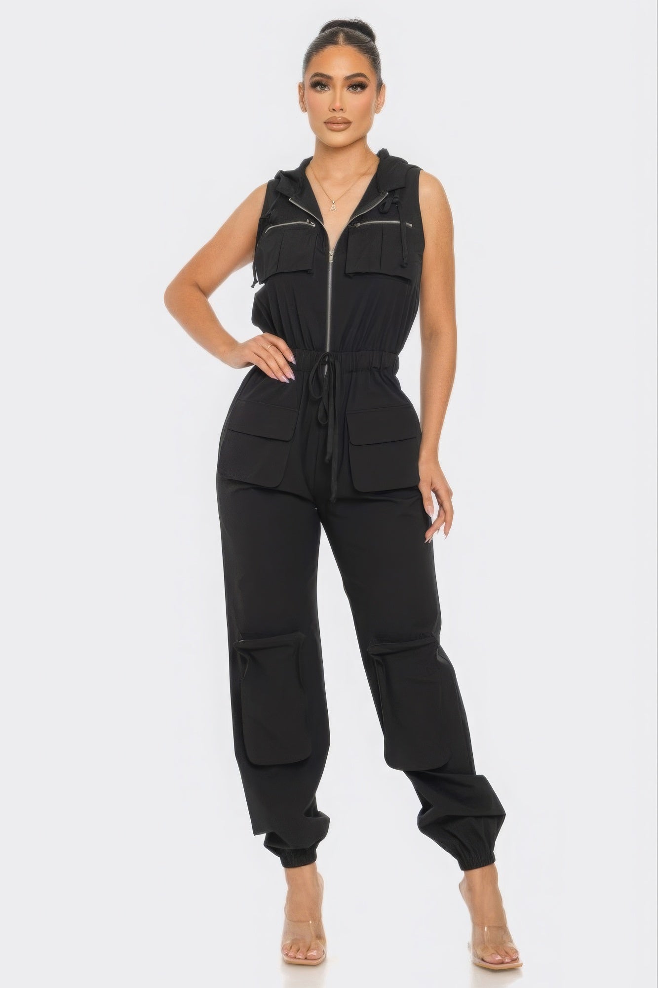 Chic Women's Tracy Cargo Jumpsuit in black, featuring a zip closure, utility design, and relaxed fit for comfortable all-day wear.