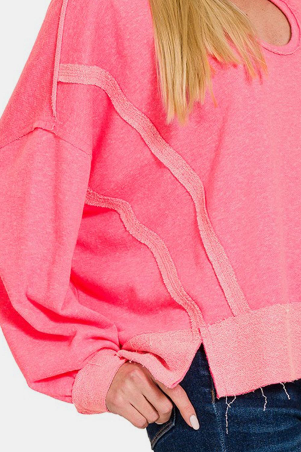 Pink contrast trim hoodie with slit and raw hem, featuring polyester, cotton, and rayon blend for casual wear.