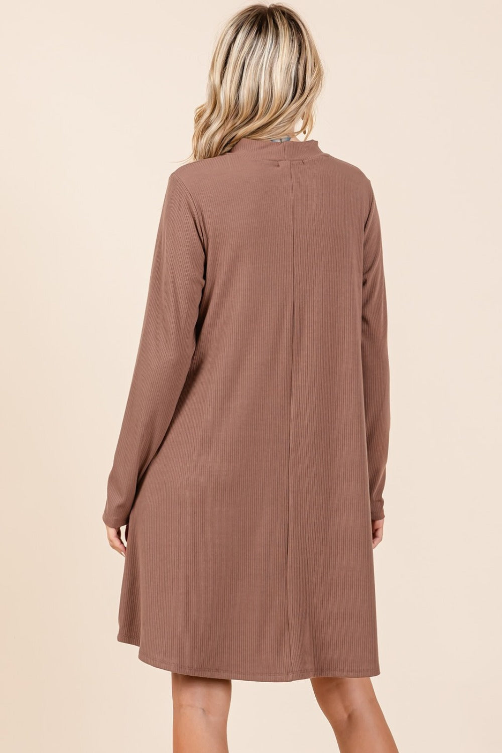 Cocoa mock neck long sleeve dress with pockets, back view, slightly stretchy and opaque, made from polyester, rayon, and spandex.