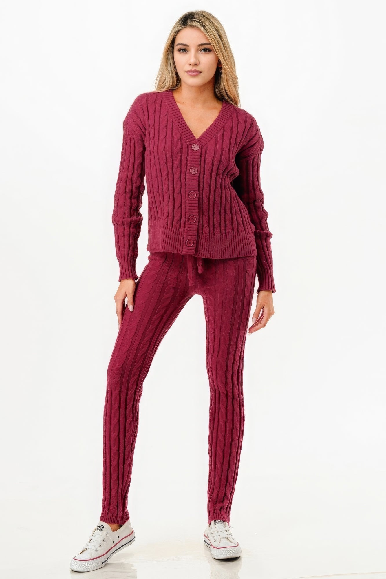 Woman wearing a wine-colored cable sweater cardigan 2pc set with a V-neck and button-up front, styled with casual sneakers.