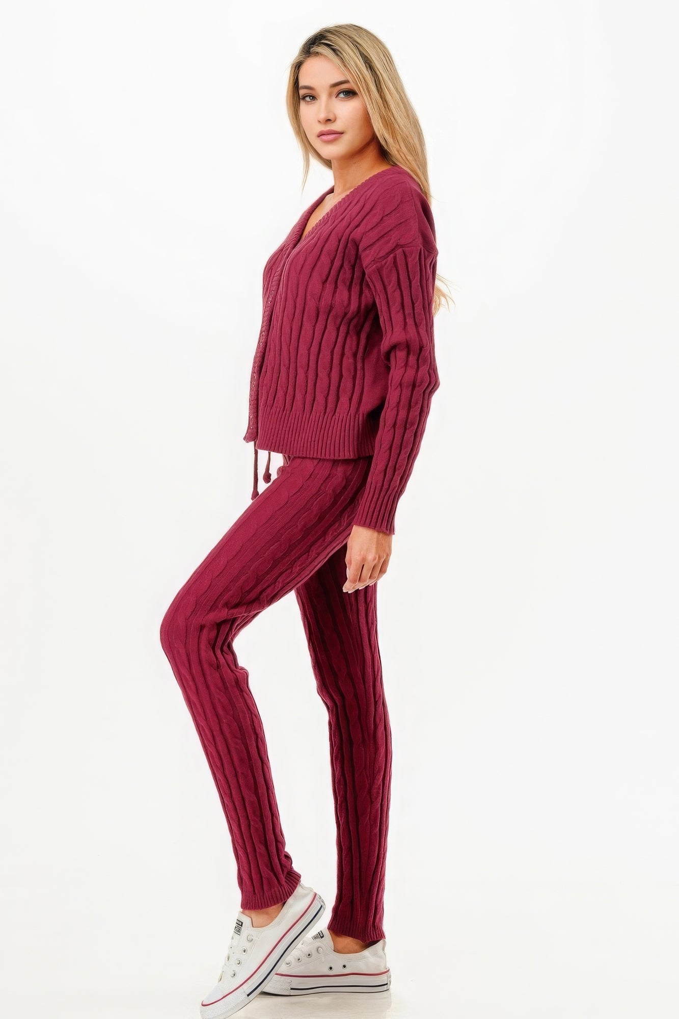 Woman wearing wine-colored cable knit sweater cardigan 2pc set with classic pattern, perfect for versatile and elegant styling.