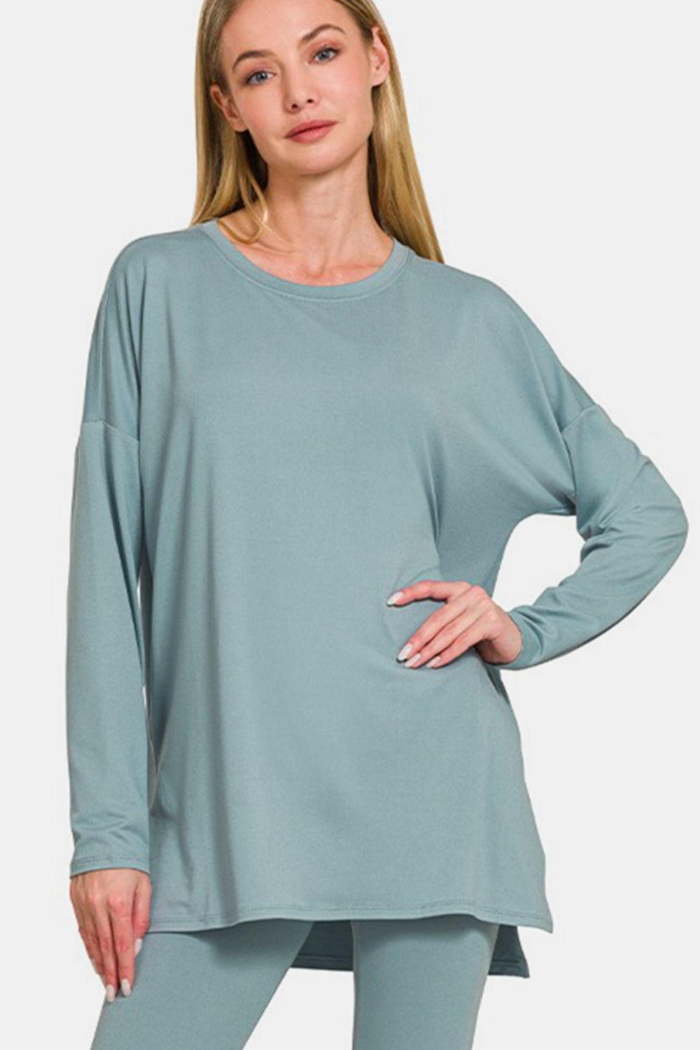 Woman wearing brushed microfiber lounge set in teal with long sleeves and a flattering silhouette.