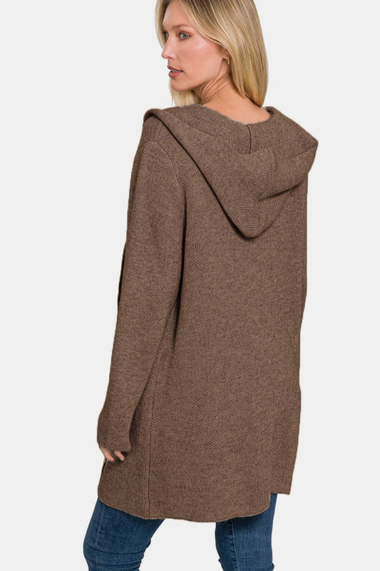 Woman wearing a cozy hooded open front sweater cardigan with front pockets, perfect for layering and casual style.