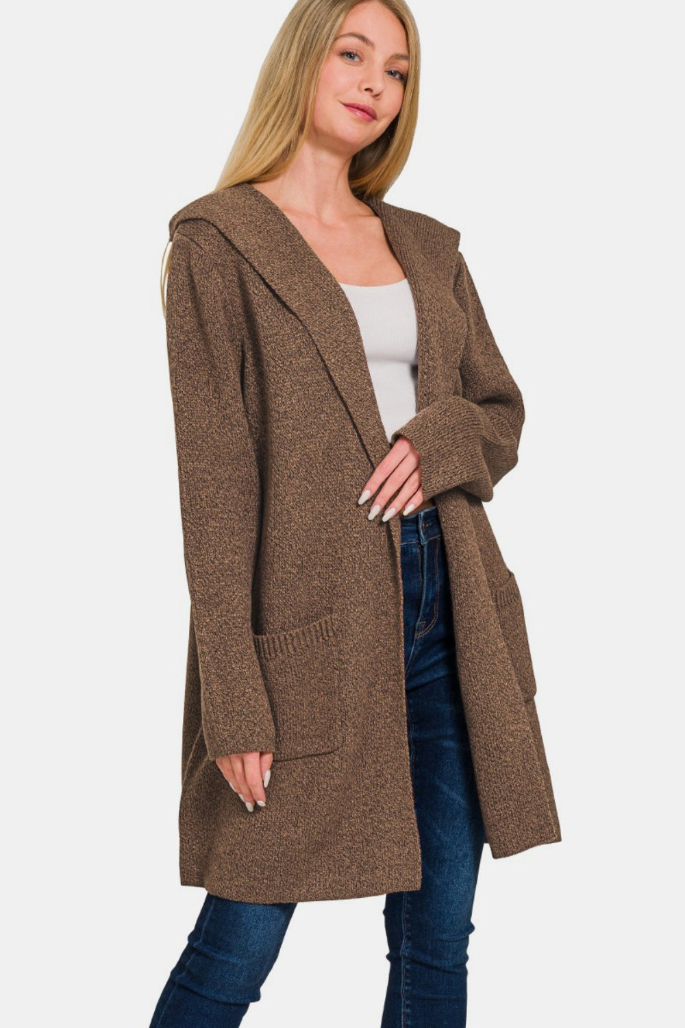 Woman wearing hooded open front sweater cardigan with pockets, perfect for layering and casual style.