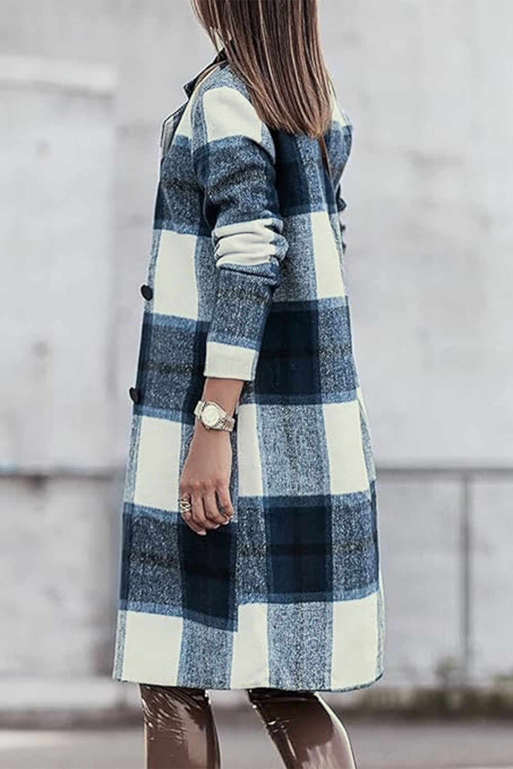 Woman wearing a full-size plaid button-up coat with lapel collar, featuring a stylish design and normal thickness for versatile use.