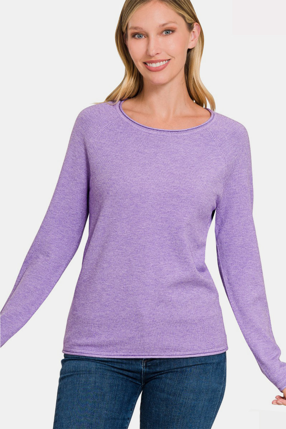 Woman wearing a purple rolled round neck long sleeve sweater with moderate stretch and comfortable fit.