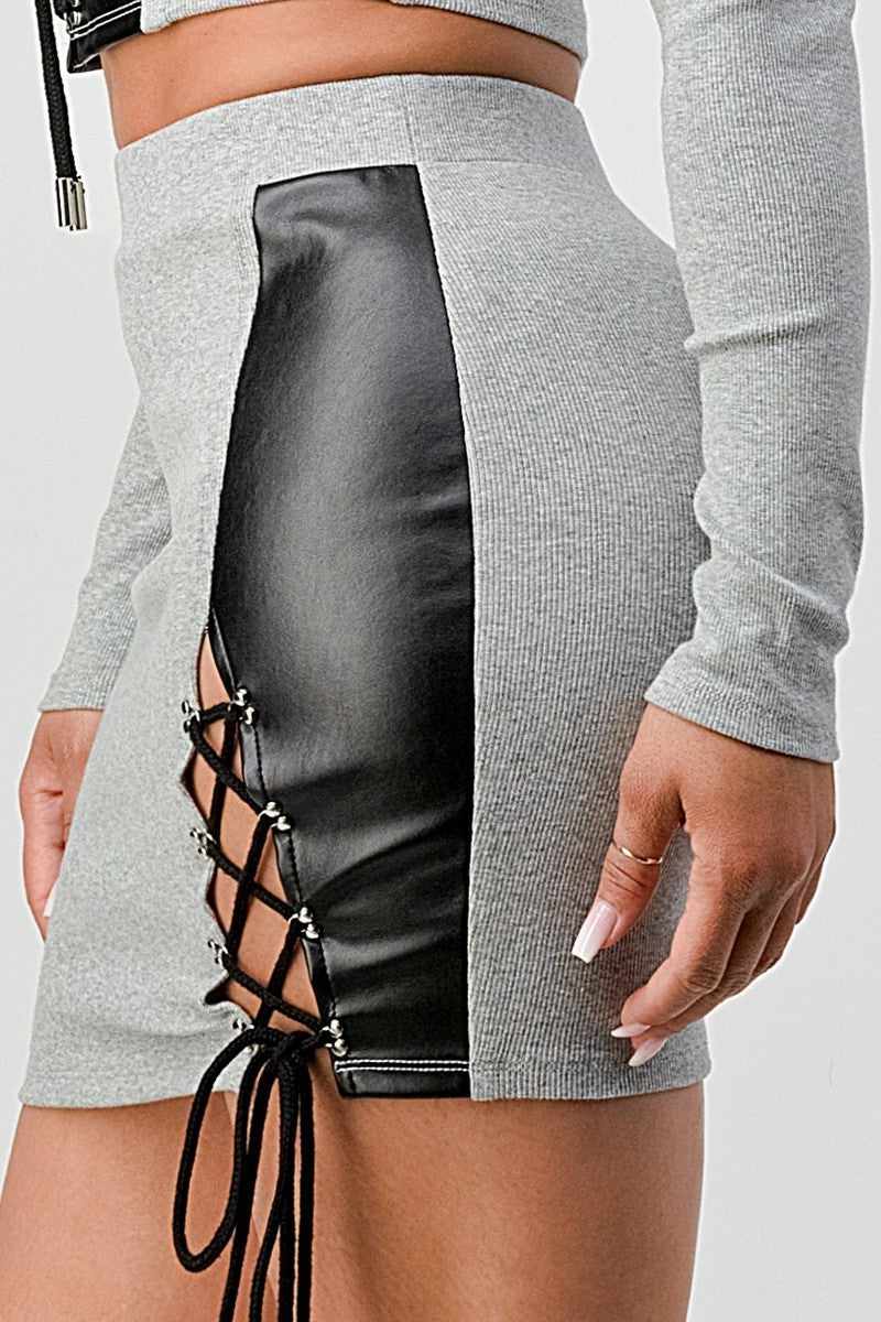 Grey cropped long sleeve shirt and faux leather mini skirt set with crisscross lacing and PU leather side details.