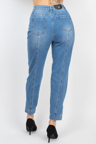 High-rise medium denim mom jeans with cuffed-button hem and princess seams detail, featuring a five-pocket design.