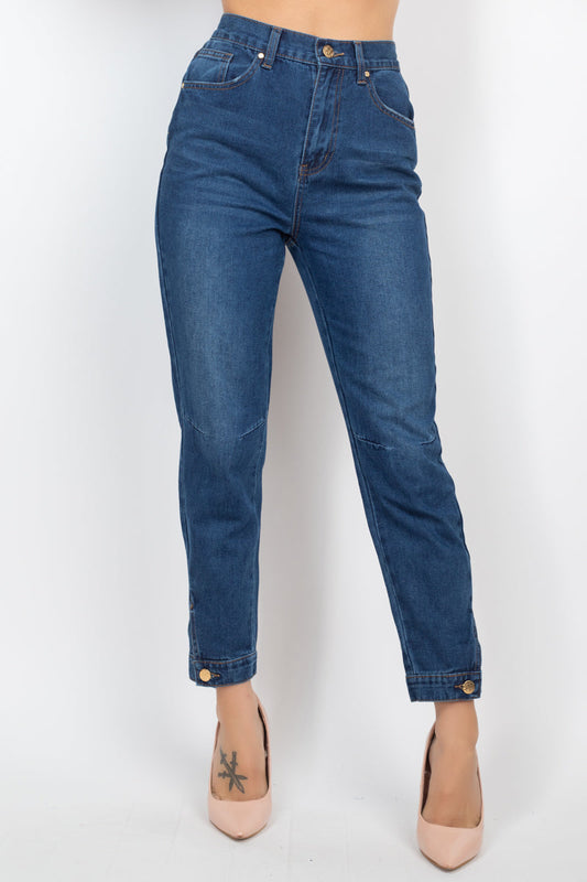 Dark denim cuffed-button mom jeans with high-rise waist, princess seams, and Capri-length hem displayed on a model.