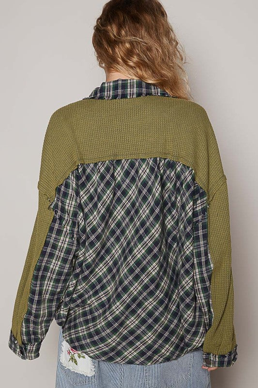 Olive plaid button-down shirt with waffle-knit texture and chest pockets, featuring a unique exposed seam design.