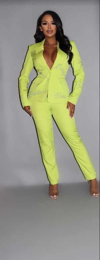 Lime two-piece power suit with rhinestone letterings, featuring a blazer and pants set, crafted from polyester-spandex blend.