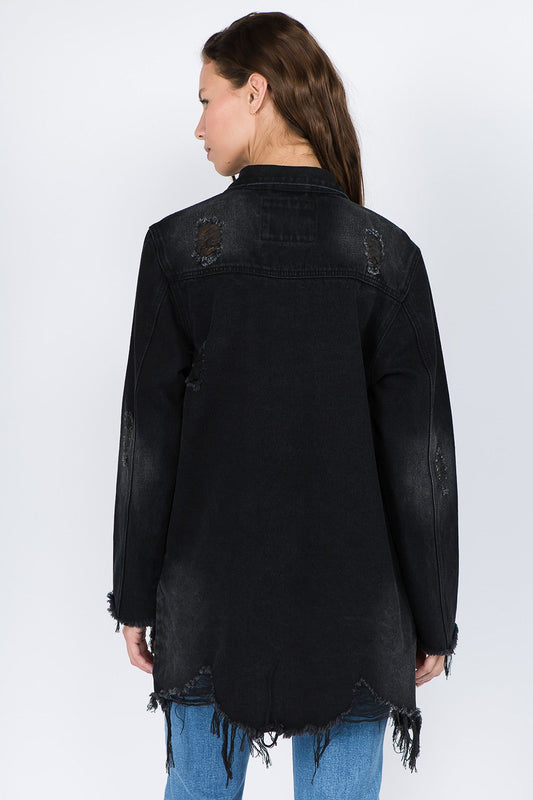 Model wearing distressed frayed hem denim jacket with raw edges and non-stretch fit, showcasing trendy back view.