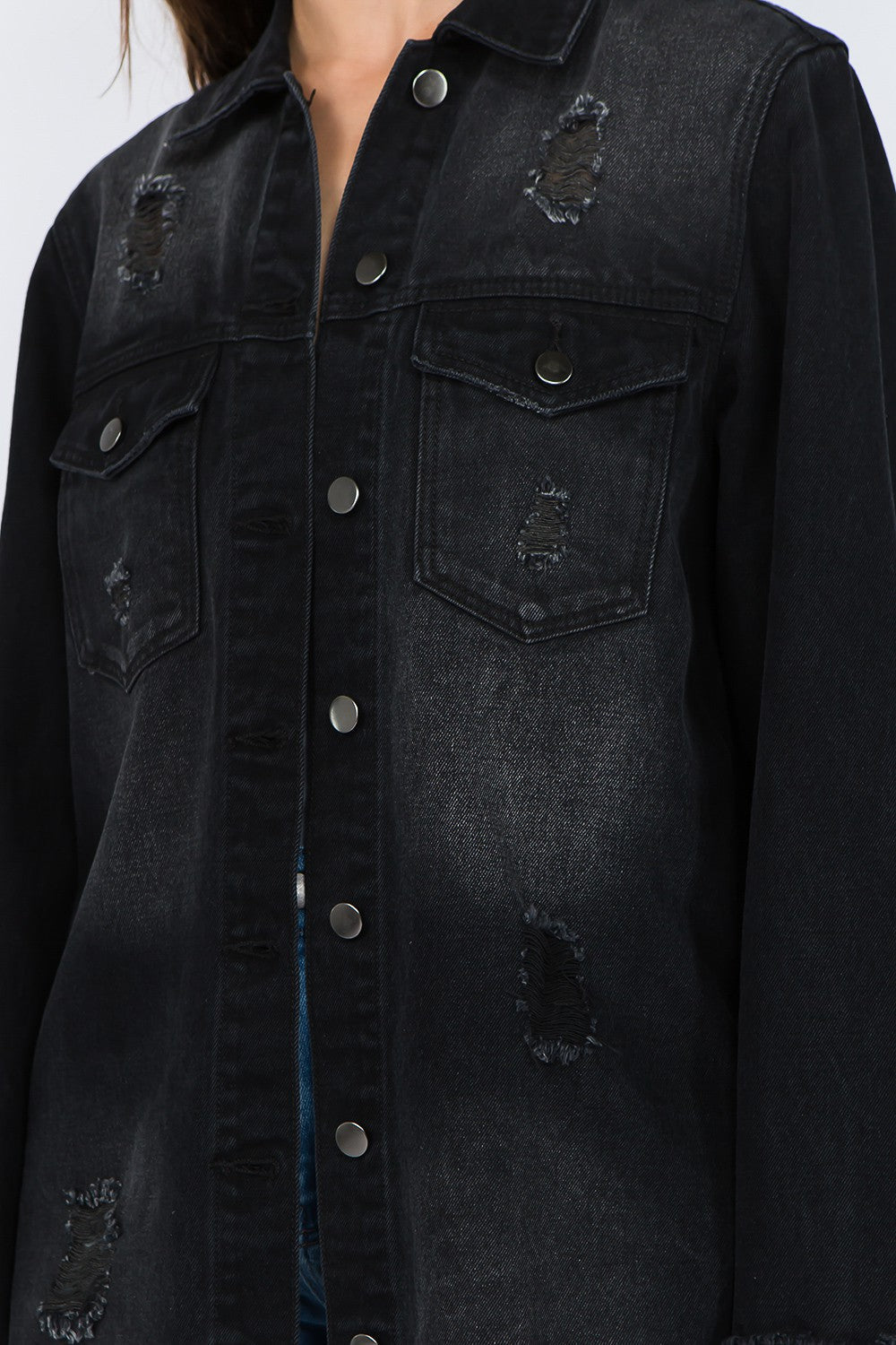 Black distressed frayed hem denim jacket with button-front closure and raw hem details for an edgy, trendy look.