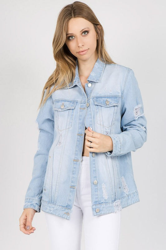 Trendy distressed denim jacket with letter patches, featuring a soft, stretchy fit and vintage washed look, perfect for versatile styling.