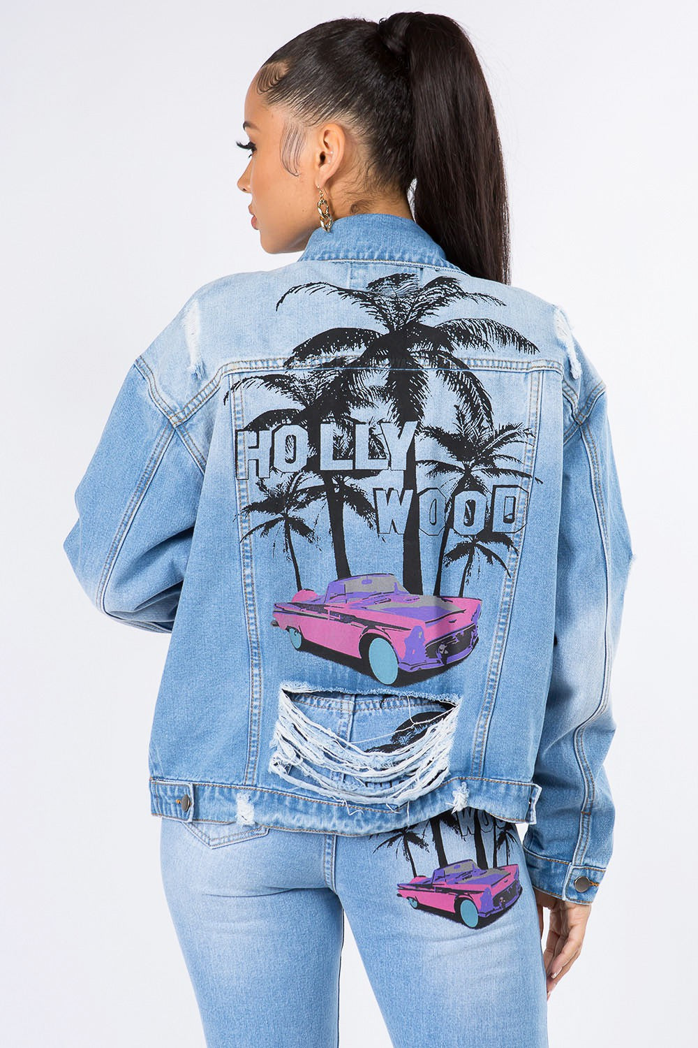 Graphic distressed denim jacket with Hollywood print and palm trees, perfect for stylish and edgy fashion lovers.