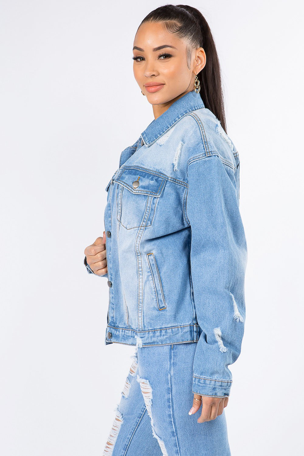 Edgy distressed denim jacket with long sleeves and graphic detailing, perfect for versatile, bold style and breathable comfort.