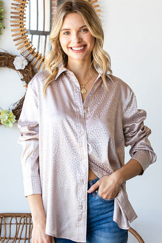 Woman wearing a Ditsy Dot Button Down Collared Satin Shirt, slightly baggy fit, with a subtle sheen in soft pastel shades.