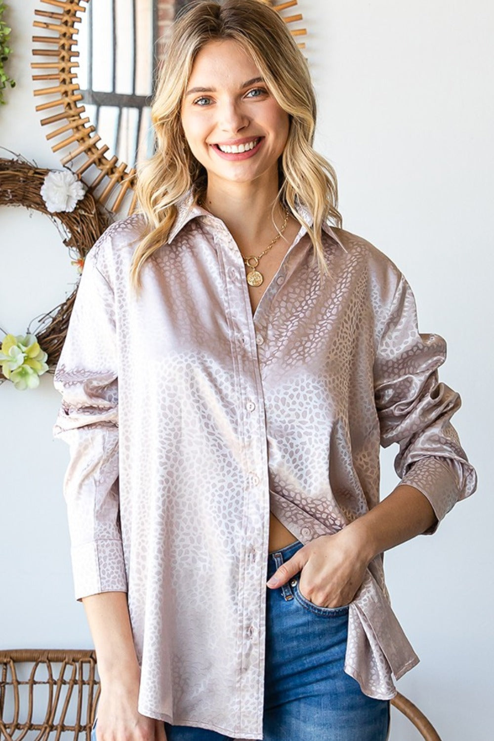 Woman wearing a Ditsy Dot Button Down Collared Satin Shirt, slightly baggy fit, with a subtle sheen in soft pastel shades.