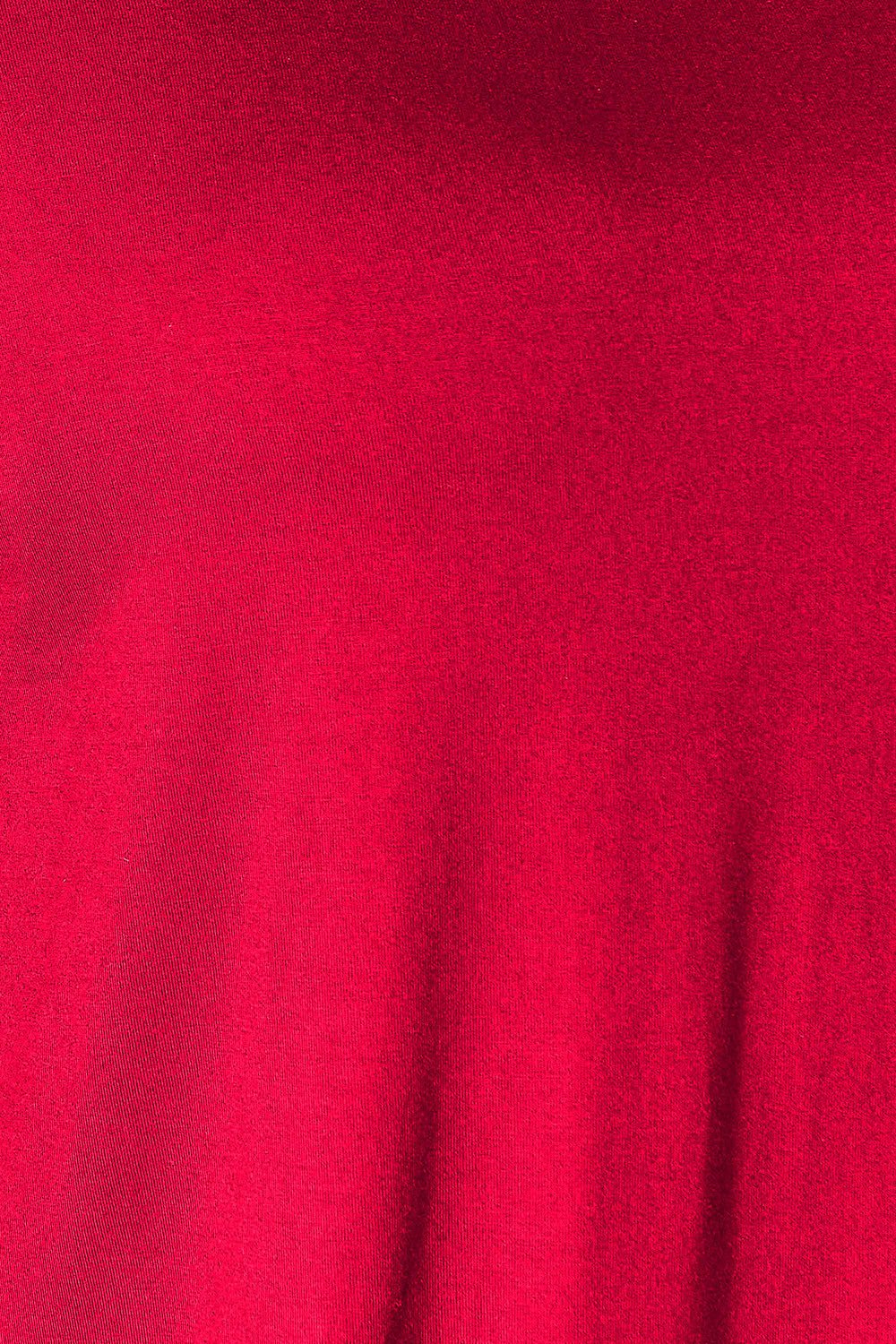 Close-up of red fabric texture from Double Take Round Neck Slit Top, showcasing soft and stretchy rayon-spandex blend.