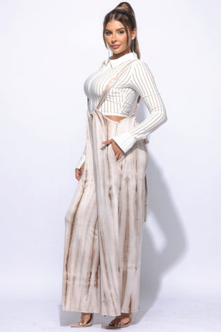Stylish tie-dye drawstring jumpsuit in mocha with a baggy silhouette, perfect for versatile fashion and comfort.