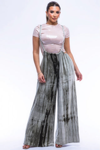 Stylish drawstring baggy jumpsuit in mocha tie-dye print, showcasing wide silhouette and comfortable fit. Perfect for versatile styling.