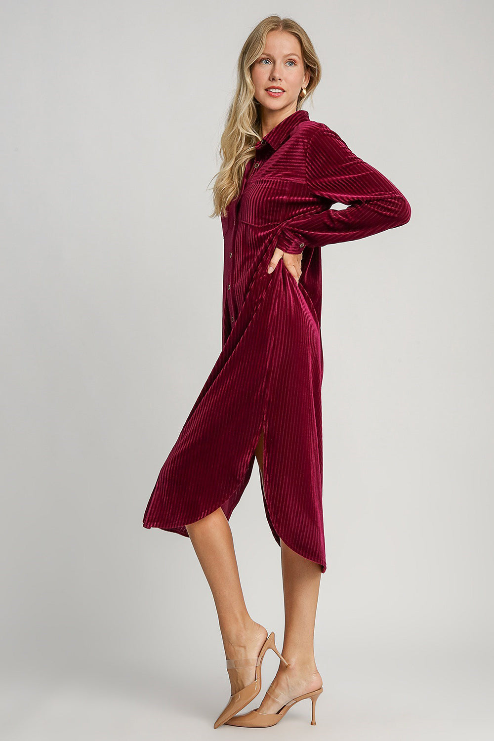 Burgundy texture curved hem button down shirt dress with slit, buttoned and pocketed, slightly stretchy, polyester spandex blend.