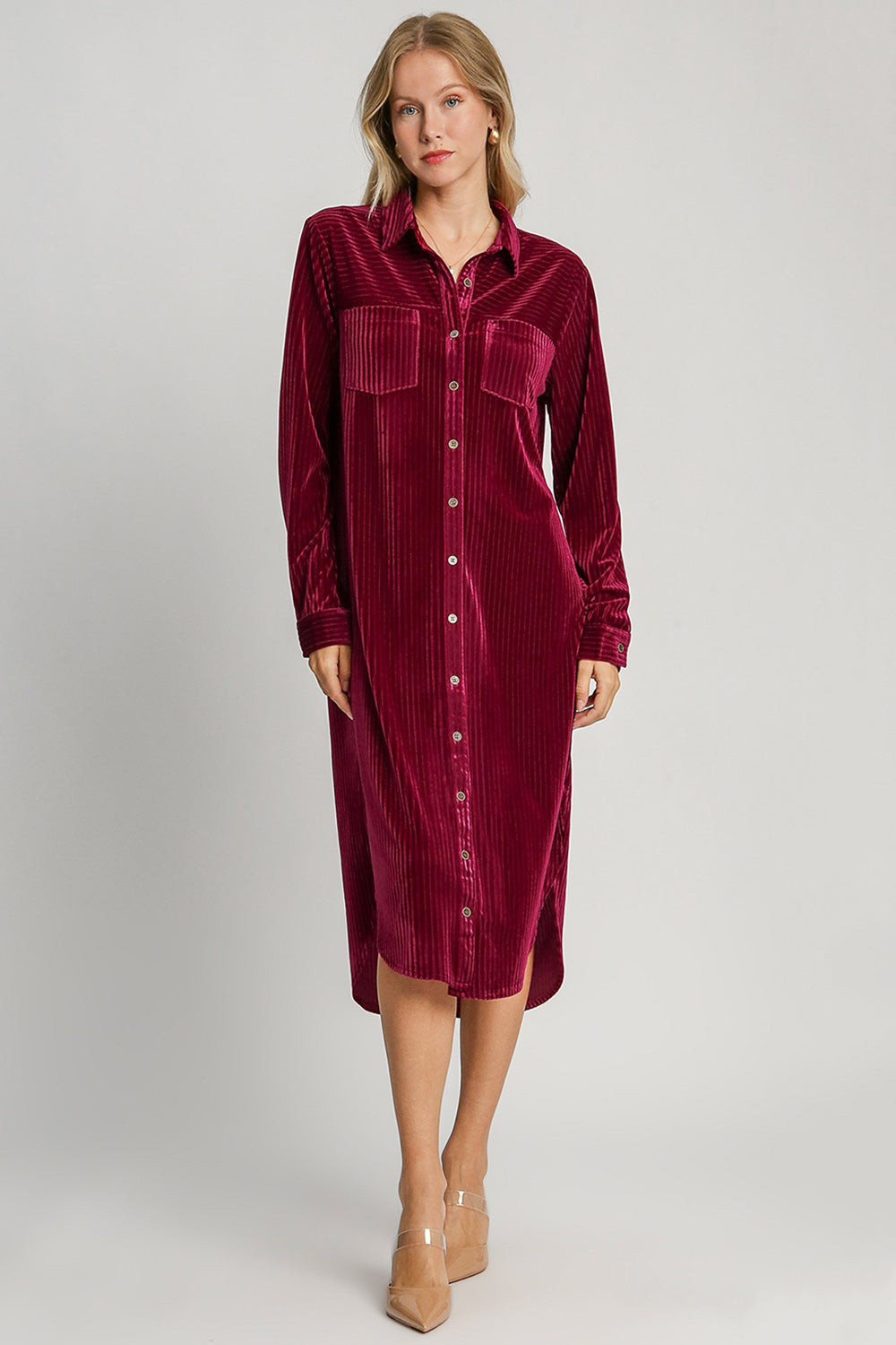 Burgundy texture curved hem button-down shirt dress with pockets and slit, long-sleeve design, slightly stretchy material.