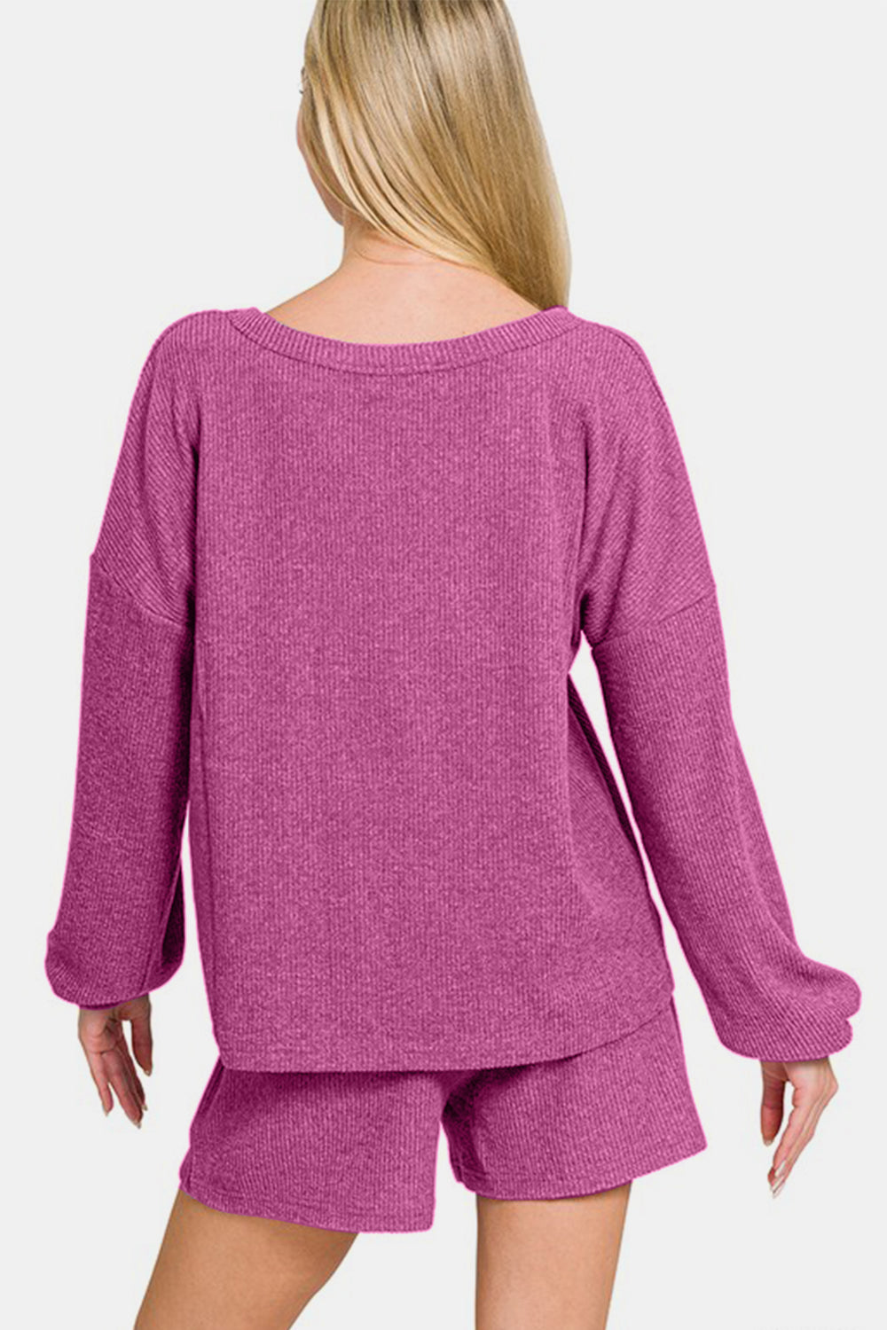 Woman wearing purple Zenana V-neck ribbed long sleeve top and shorts set, showcasing casual and chic style.