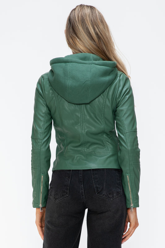 Woman wearing a green faux leather zip-up jacket with a drawstring hood and zipper cuffs, shown from the back.