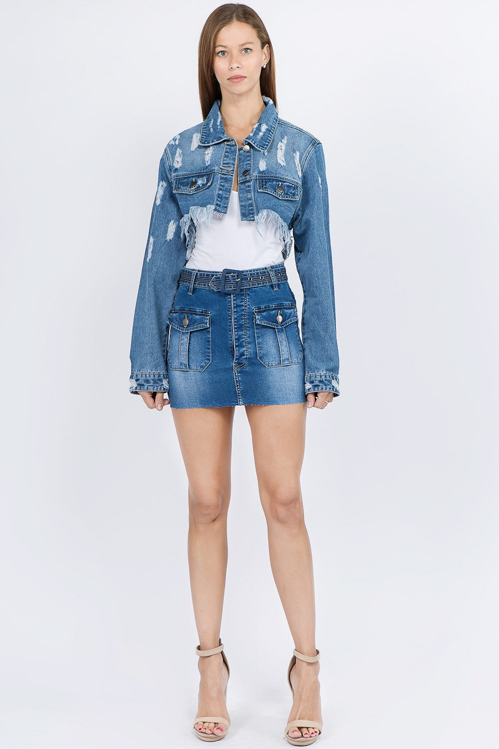 Distressed denim jacket with frayed hem, button-front closure, and edgy details, perfect for casual and trendy outfits.