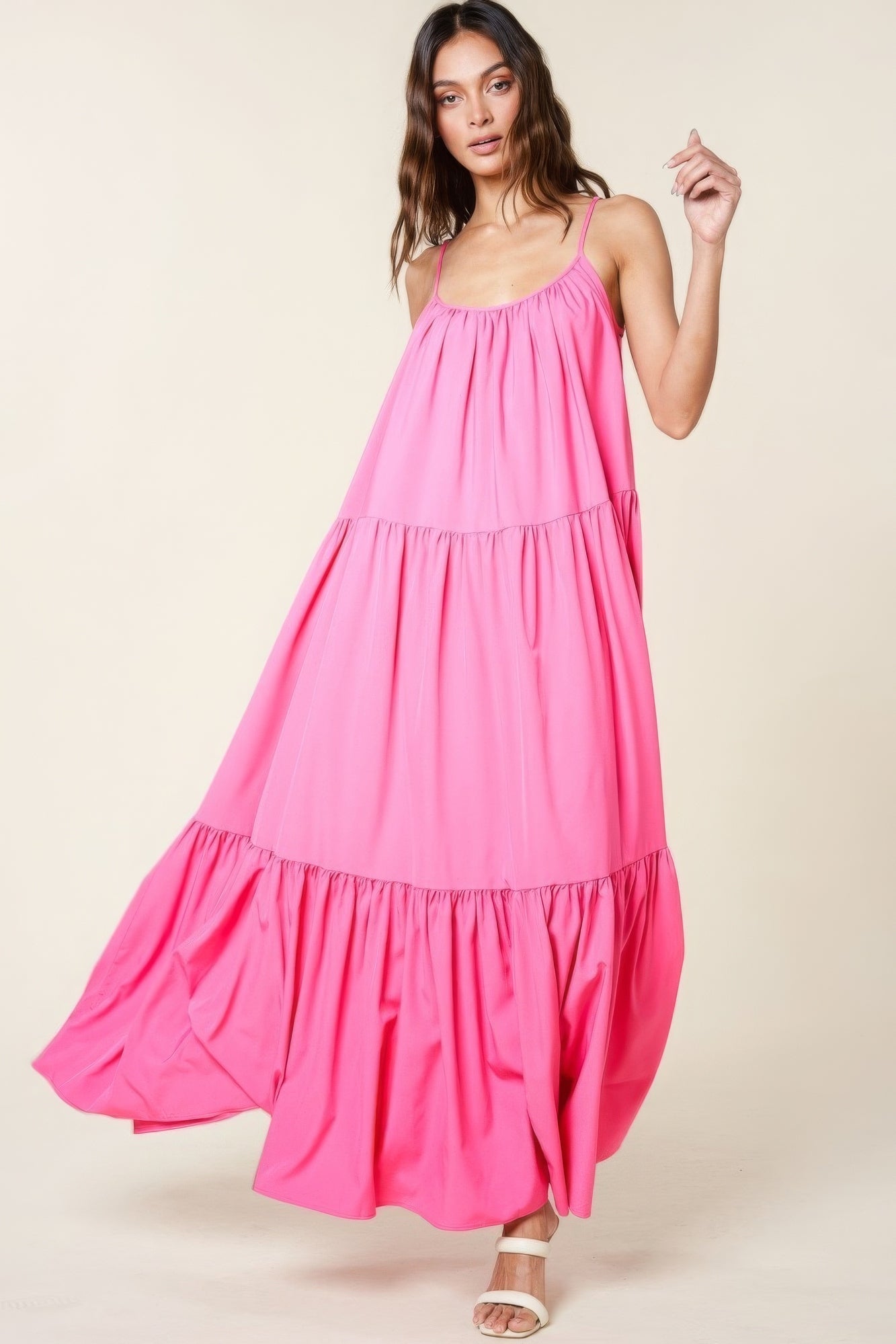 Pink maxi sun dress with adjustable straps and flowy A-line cut, featuring side pockets and a flattering, lightweight design.