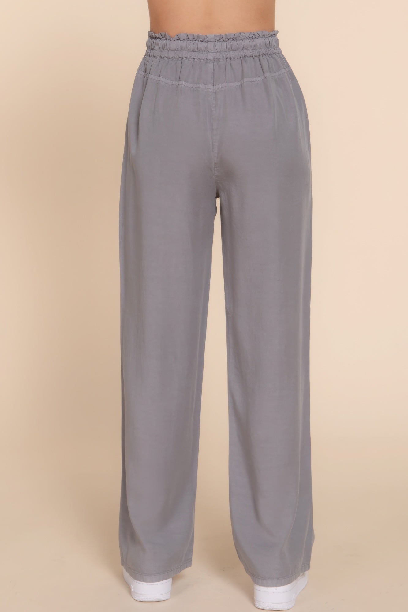 Grey Tencel long pants with elastic waist for comfort and style, back view, showcasing versatile design and luxurious softness.