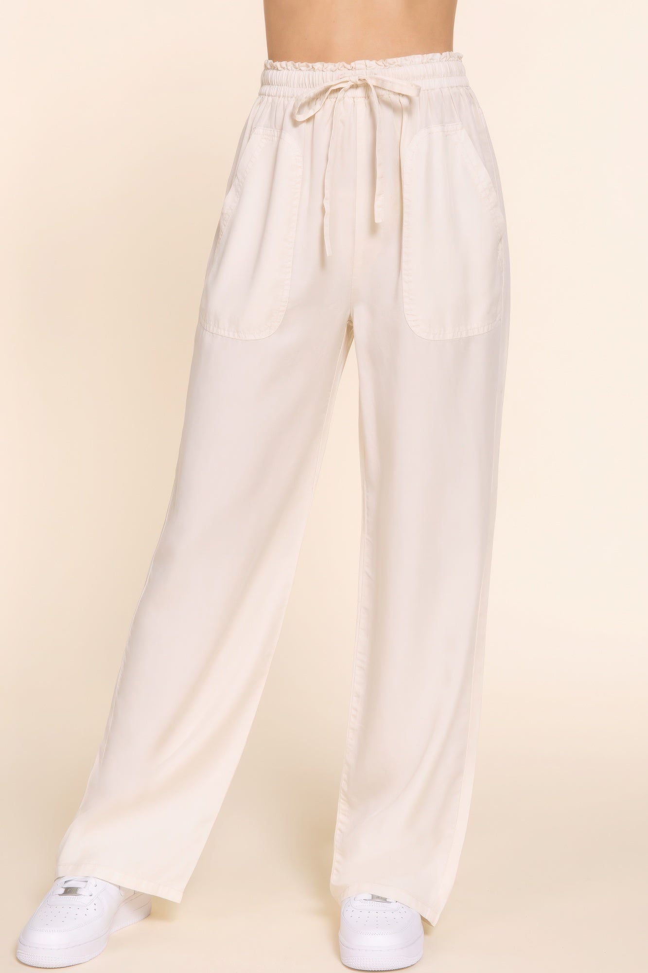 Elastic waist Tencel long pants in cream, featuring soft luxurious fabric and versatile style for comfort and everyday wear.