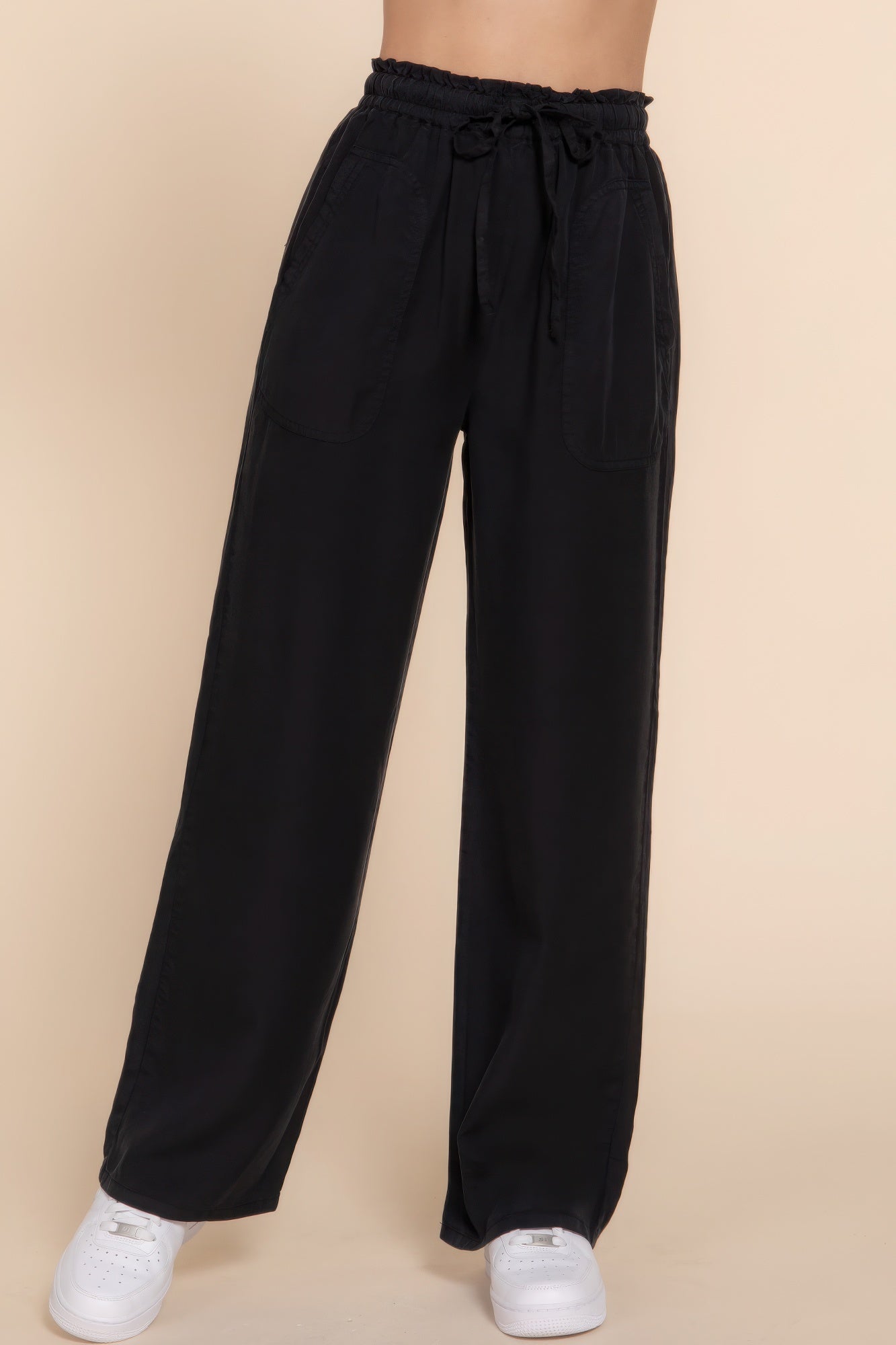 Black Tencel long pants with elastic waist, showcasing comfort and style for a versatile wardrobe option.