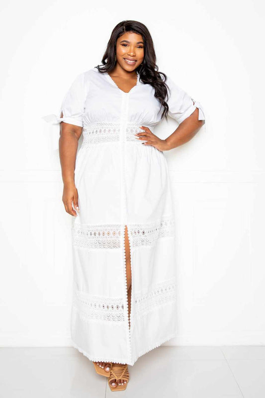 Plus size model wearing a white puff sleeve maxi dress with lace insert, featuring a front slit and elegant design. Perfect for summer.