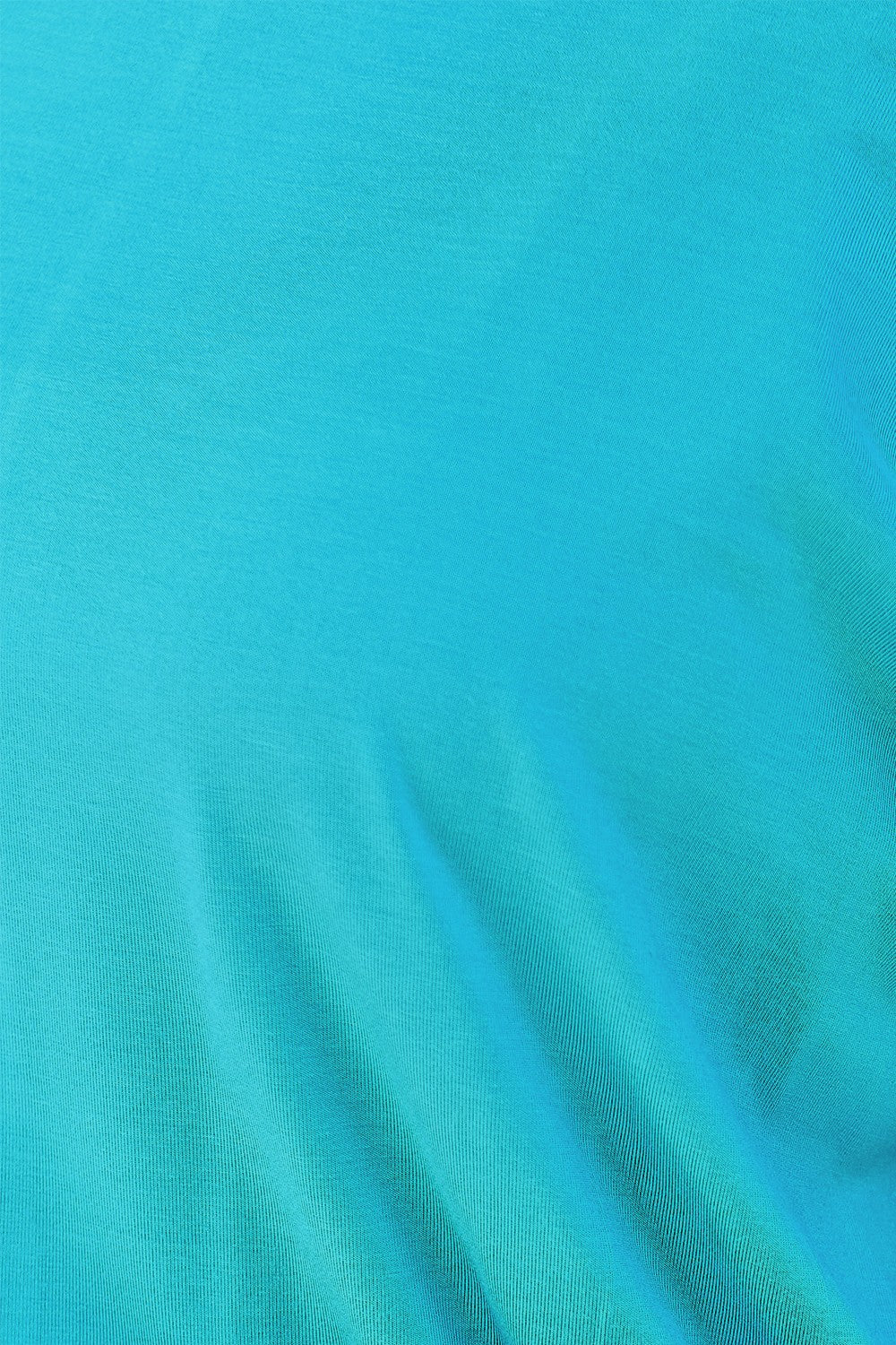 Close-up of vibrant turquoise fabric, slightly stretchy with a smooth texture, made of rayon and spandex blend.