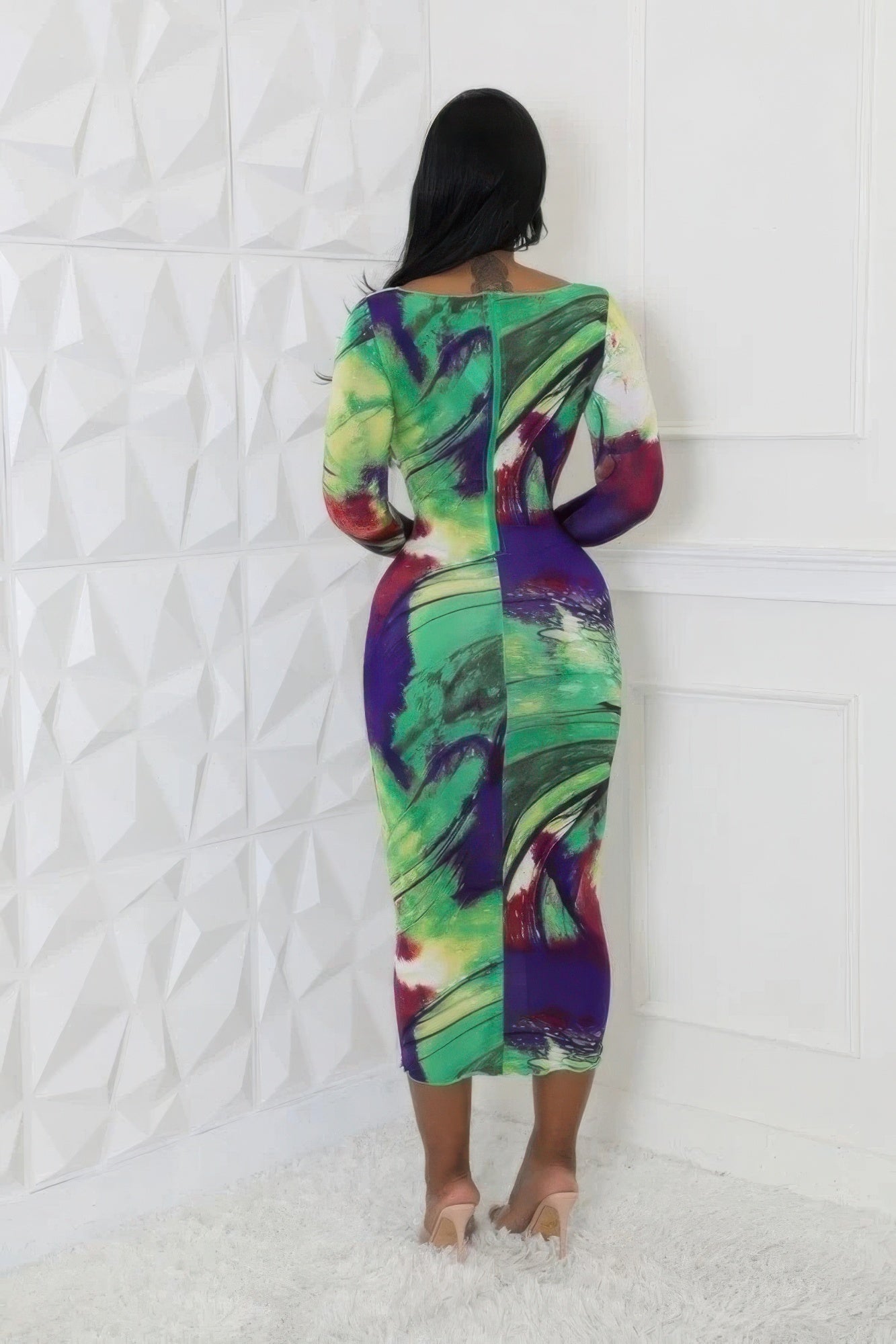 Vibrant multi-color stretch dress with round neckline, long sleeves, and stylish cutouts, featuring a flattering silhouette.